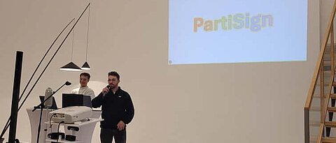 Dr. David Obremski and Dr. Max Tretter present their project PartiSign